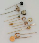 A 9ct gold pin brooch, initialled, another horseshoe-shape stamped 15ct, 5.6g and nine others