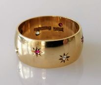 A 9ct gold, diamond and ruby gypsy ring, size T, hallmarked, 8.89g