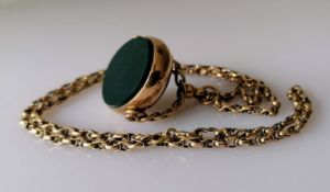 An Edwardian 9ct gold-framed swivel fob by John Grinsell & Sons, Birmingham, 16.7g
