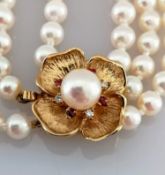 A three row, two-hundred and thirteen cultured pearl necklace, each measuring av. 4.95mm on a 9ct