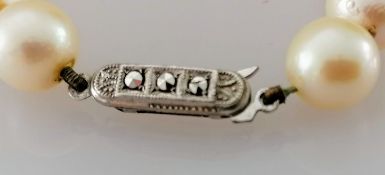 An Art Deco cultured pearl necklet comprising forty-three Akoya beads measuring 7.9mm to 8.5mm on