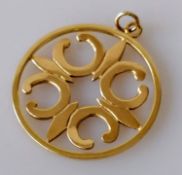 A 9ct yellow gold carved pendant, 36mm diameter, hallmarked, 8.12g