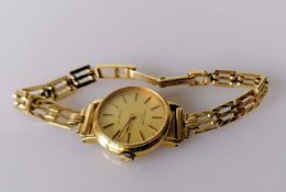 A 9ct gold-cased mid-century Favre-Leuba quartz ladies dress watch with champagne dial, baton