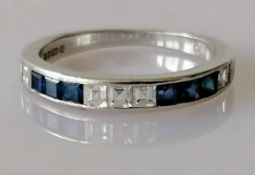 An 18ct white gold half-hoop sapphire and diamond eternity ring, channel-set with six square-cut