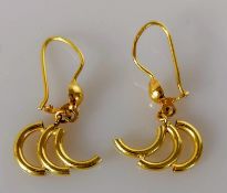A pair of gold earrings with C-pipe design, unmarked, tests for high quality gold, 3.82g