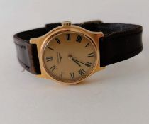 A Longines manual wristwatch, signed gilt, dial with Roman numerals, later strap, 33mm diameter