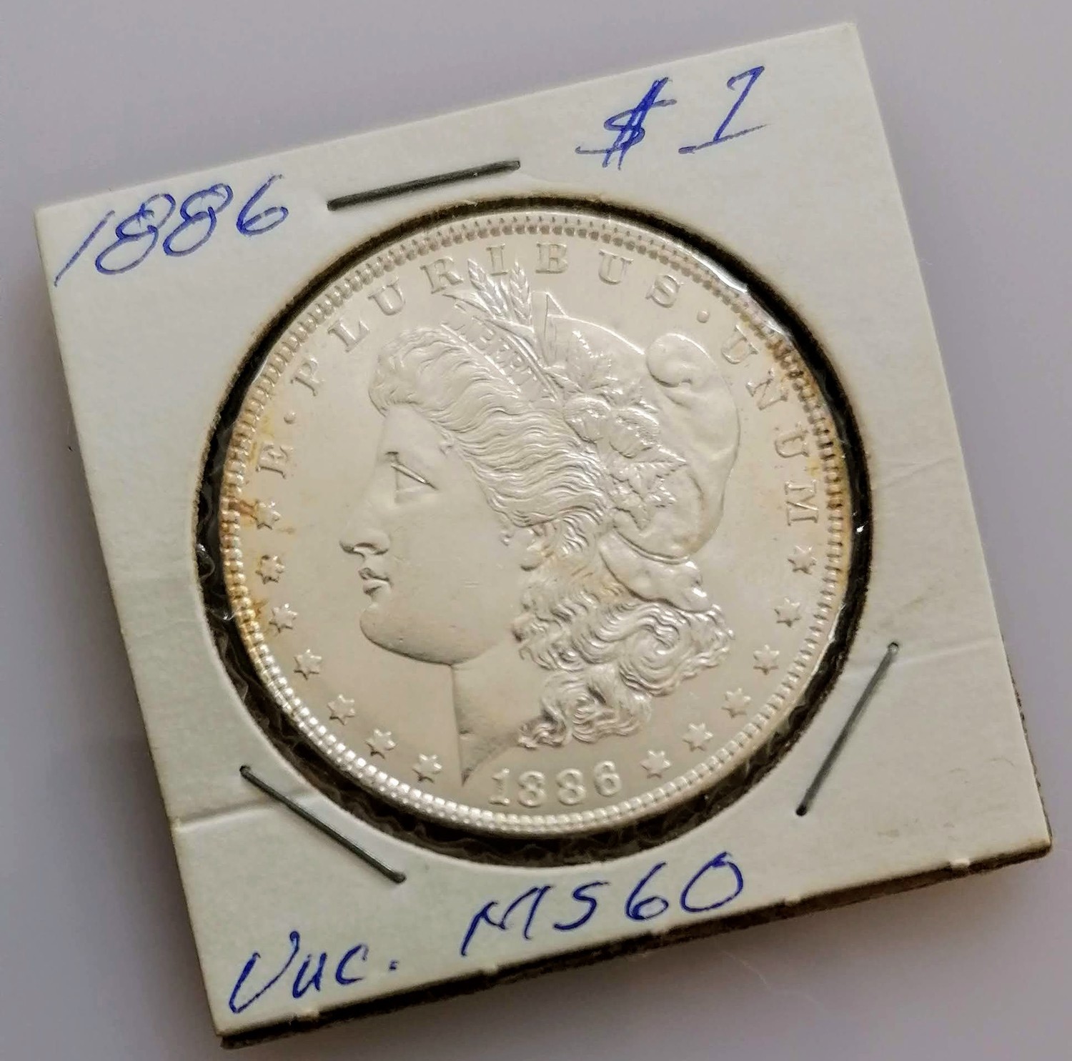 An 1886 Morgan one dollar coin, graded MS-60; three 1776-1976 quarter dollar coins, Denver mint - Image 3 of 4