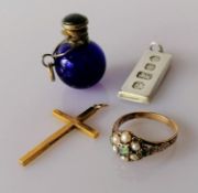A late Victorian gold ring with seed pearl and peridot cluster decoration, etched shoulders,
