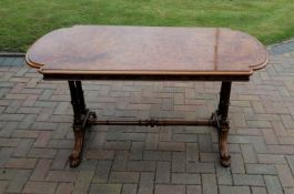 A mid-19th century burr walnut writing or library table with inlay decoration, plain frieze, bow