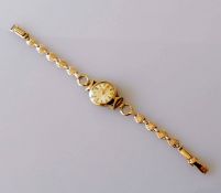 A ladies 9ct gold Avia cocktail watch with fancy-link bracelet, baton markers, Swiss hallmarks, 10.