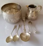 A Victorian Anglo-Indian silver embossed bowl (8.5 h x 11 cm diameter) and creamer (8.5 cm H) by