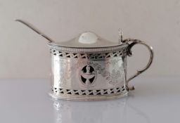 An Edwardian silver oval mustard pot with beaded borders, pierced body, bright-cut floral swags