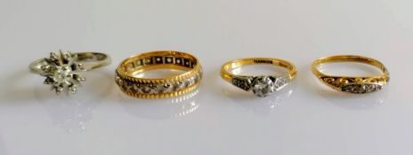 A white gold star-ring with diamond decoration; a white and yellow gold eternity ring; a gold and
