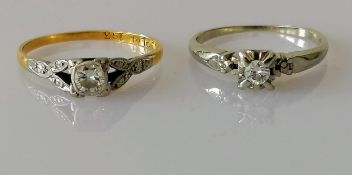 An early 20th century yellow gold and platinum diamond solitaire ring, round-cut diamond