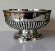 An Edwardian silver rose bowl with half-fluted decoration on a raised foot by Mappin & Webb,