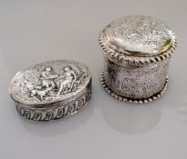 Two Continental 19th century silver boxes with allegorical scenes in relief to lids and sides,