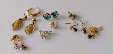 Five and a half pairs of earrings, two more with matching pendants, most gem-set, all stamped/