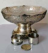 A George V silver tazza with a frosted glass liner, wavy rim, elaborate pierced decoration on a