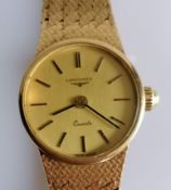 A 1980's ladies 9ct gold Longines quartz wristwatch, the circular gold tone dial signed 'Longines