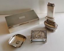 An Art Deco silver cigarette box with engine turned design, wood-lined interior, vacant cartouche by