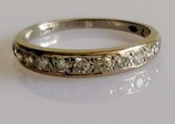 A white gold and diamond half-hoop eternity ring, size O, 2.63g