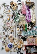 A large assortment of costume jewellery to include necklaces, brooches, rings, watches, etc.