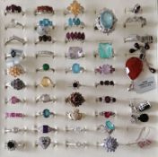 An assortment of forty silver -based gem-set rings, mostly sizes N-P, three pairs of earring and a