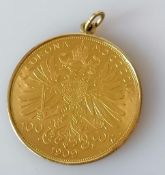 A mounted 1909 Austrian, Franz Joseph I 100 Corona gold coin, the mount stamped 585, 35.87g