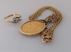 A Victorian gold full sovereign, 1872, on a hallmarked 9ct gold mount and chain, 13.9g and a 18ct