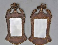 A near pair of Queen Anne period walnut and giltwood wall mirrors, Campana carved and scrolling