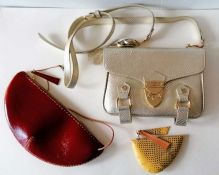 An Aspinal of London crossbody leather bag in silver, adjustable strap, zipped interior pocket and f