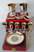 A cased pair of vintage silver goblets with gilt interiors each 8cm H; five silver liqueur shots