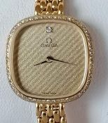 A vintage Omega ladies quartz 1387 wristwatch, circa 1990, with square striped face, 17mm