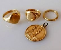 Two gold signet rings, both initialled, a gold wedding band, sizes T, O, K and a St. Christopher med