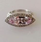 A kunzite and diamond dress ring, the horizontal set marquise-cut kunzite 16.5 x 7.08 x 5.5mm, weigh