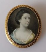 An early 19th century oval portrait miniature on ivory of Susan Metcalf, unsigned, in a gold frame