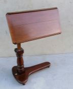 A Victorian mahogany adjustable bed table on castors by Alfred Carter, Holborn