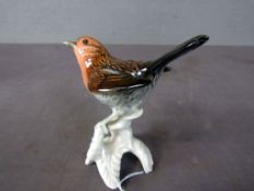 Porzellanfigur Vogel auf Ast gemarkt