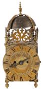 A brass lantern mantel clock: the eight-day duration double-fusee movement striking the hours on a