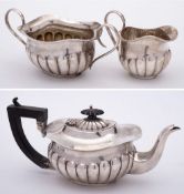 An Edward VII silver three-piece batchelor's tea service, maker Joseph Gloster Ltd, Birmingham,