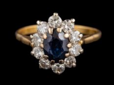 A sapphire and diamond cluster ring:,