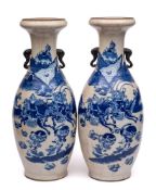 A pair of large Chinese blue and white crackle glazed vases: of baluster form with elephant head