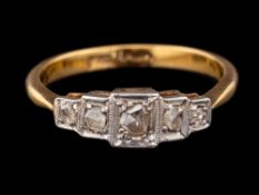 A diamond ring,: set with five rose cut diamonds, stamped 18ct Plat, ring size Q.