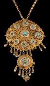 A turquoise and seed pearl pendant,: the filigree panel set with cabochon turquoise and seed pearls,