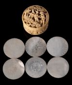 A Cantonese carved ivory circular box and lid: containing mother-of-pearl gaming counters,