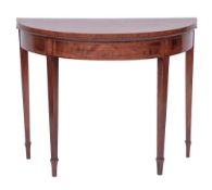 A George III mahogany and crossbanded demi-lune card table in Sheraton style,