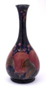 A William Moorcroft bottle vase: with slender waisted neck and flared rim,