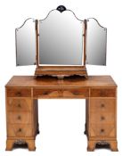 Waring & Gillow Ltd A walnut veneer, burr figured,