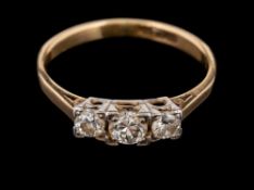 A diamond three stone ring,: the three brilliant cut diamonds, estimated to weigh 0.