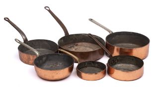Six assorted copper graduated non matching saucepans: with steel handles, various sizes,